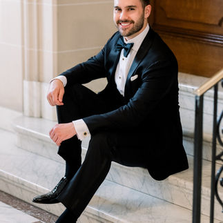 Groom Sitting on Steps