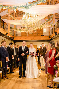 Bride walking down the aisle escorted by her father