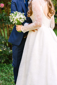Newlyweds hug in a garden