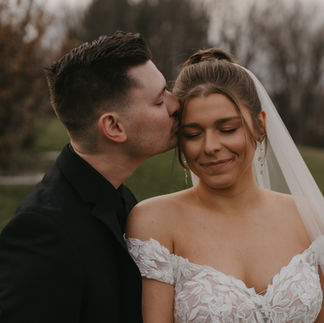 Groom Kissing Brides Cheek