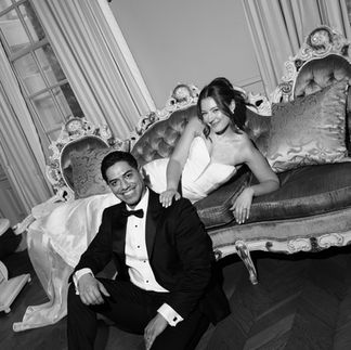 Bride and Groom Smiling on Couch