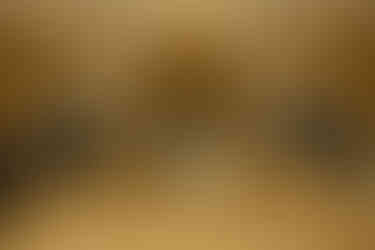 The bride and groom participating in the shoe game