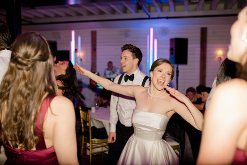 Bride smiling and dancing on the dance floor