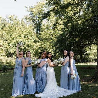 Bride posing with bridesmaids