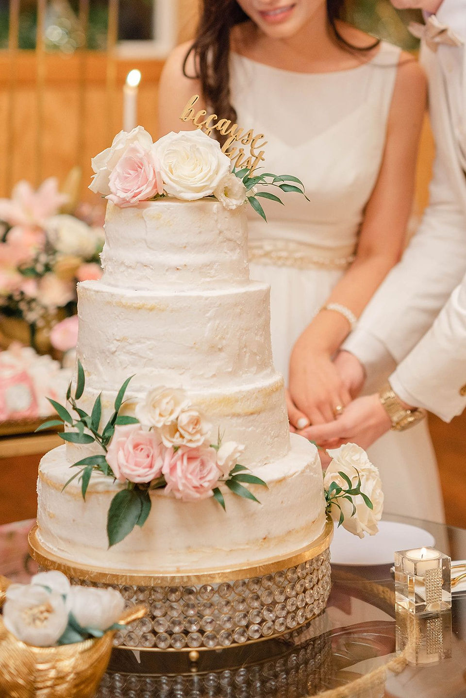 bride and groom cut the cake