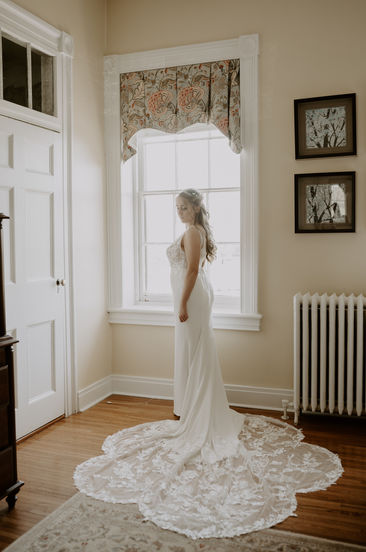 Bride looking out the window at Marriott Ranch