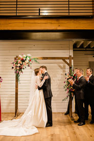 A bride and groom's first kiss as newlyweds