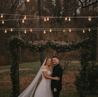 Bride and Groom Kissing Outside Venue
