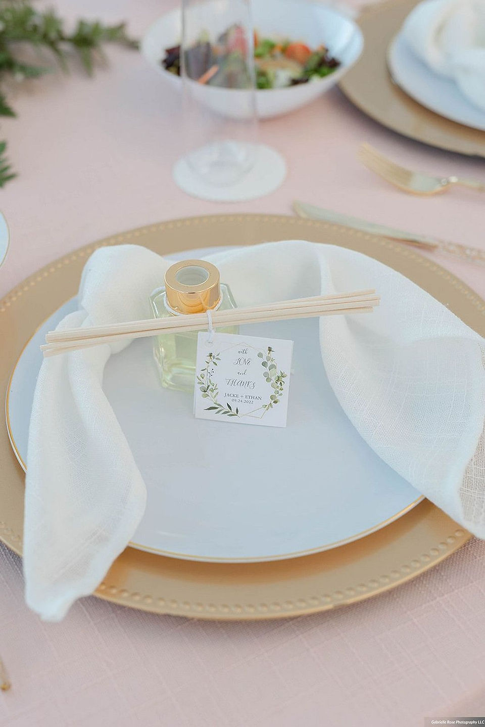 Custom perfume wedding favor on a plate