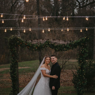 Bride and Groom Smiling at Altar