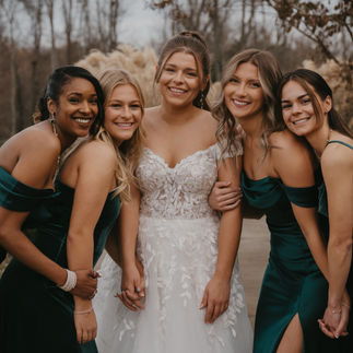 Bride smiling With Bridesmaids