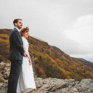 Bride and Groom Overlooking Mountains