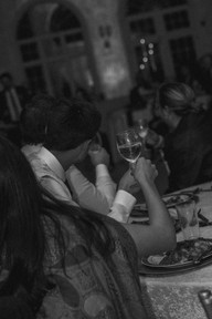 The guests cheering and toasting for the newlyweds