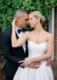 Newlyweds hugging in a garden