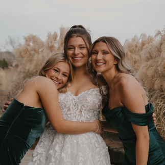 Bride Hugging Bridesmaids