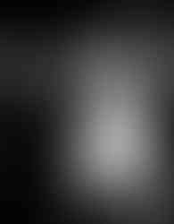 A groom holds his bride from behind