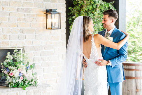 Bride and groom hug each other at ceremony