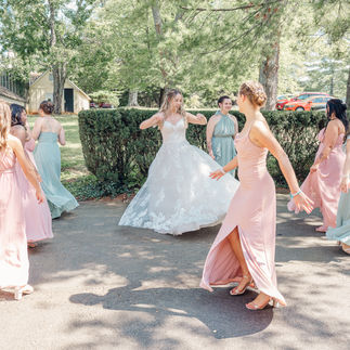 Bride and Bridesmaids Dancing