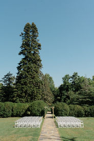 An outdoor wedding ceremony in a garden