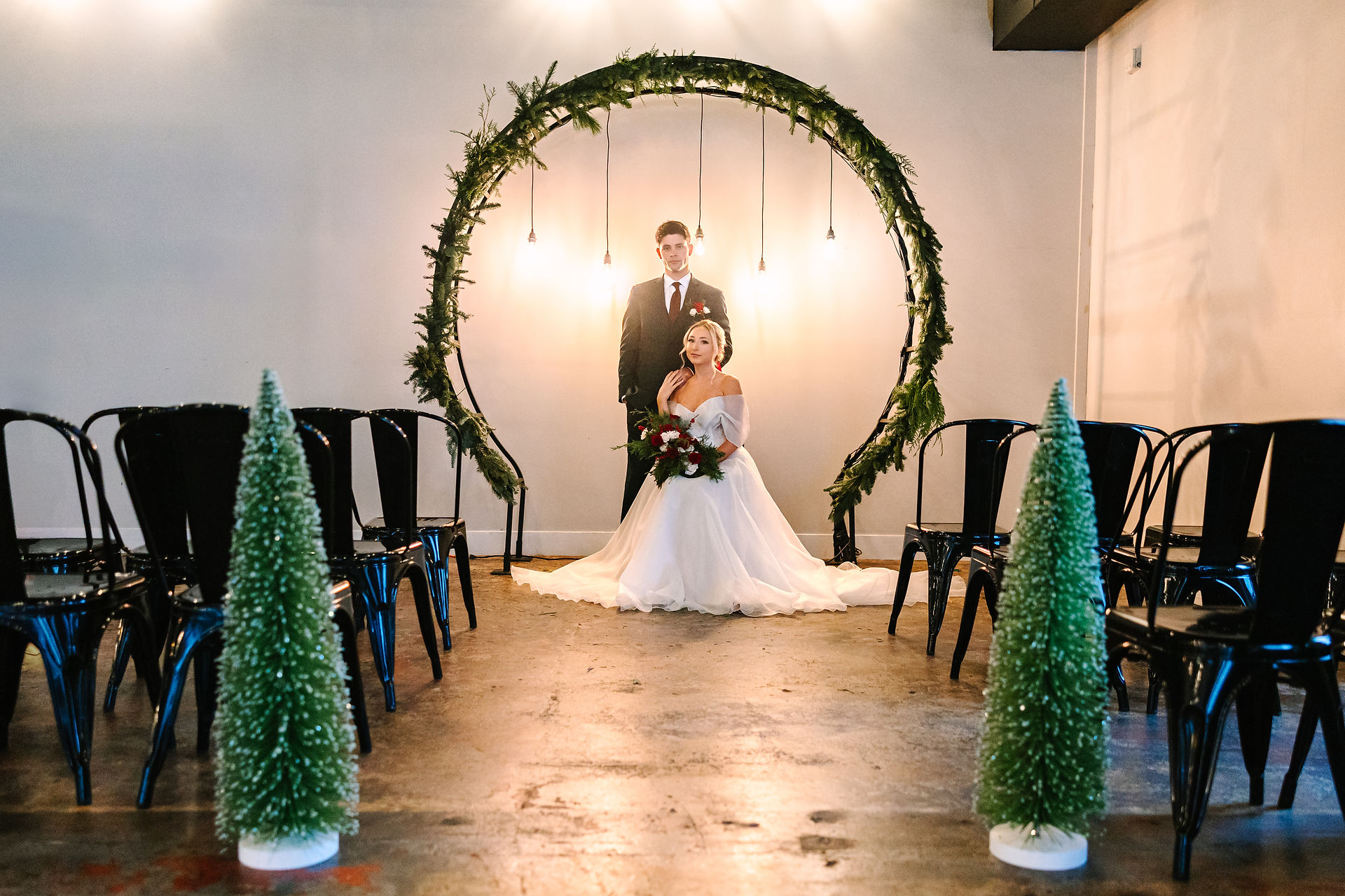 Bride and groom posing for ceremony photos