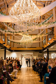 A grand ballroom wedding ceremony at Brentsville Hall