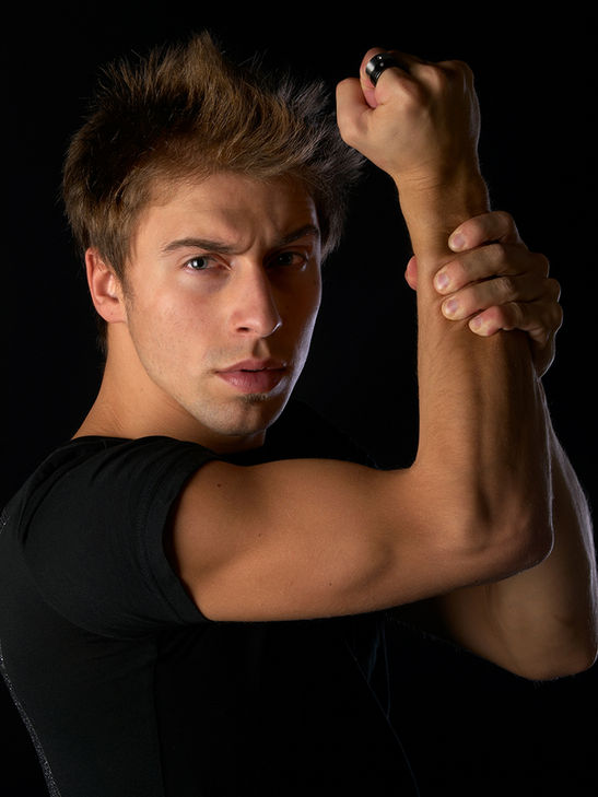 Male face in chiaroscuro, fine art studio portrait, Claude Gauthier portrait photographer Montreal