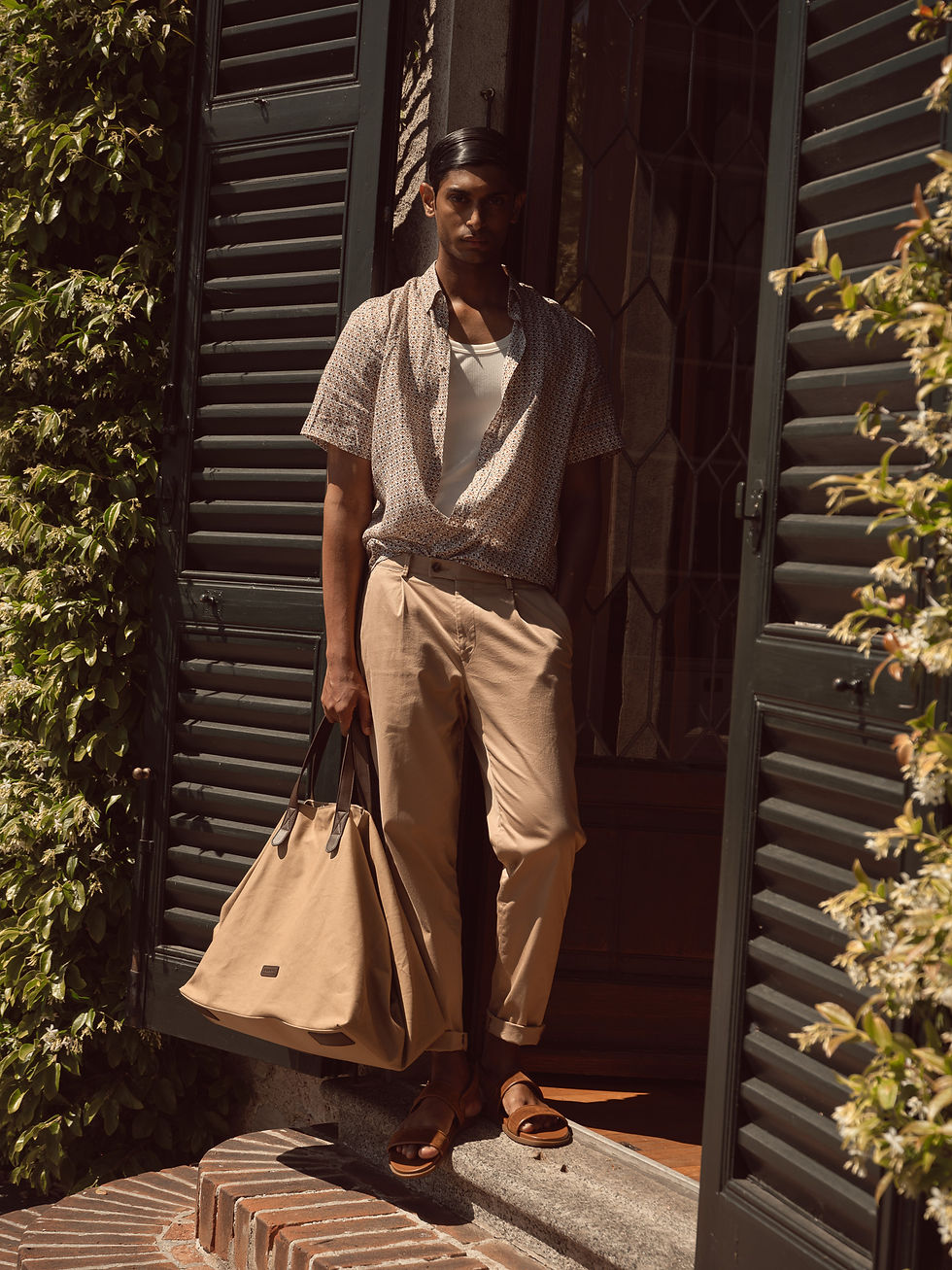 Main campaign look featuring a male model in regal gold traditional menswear