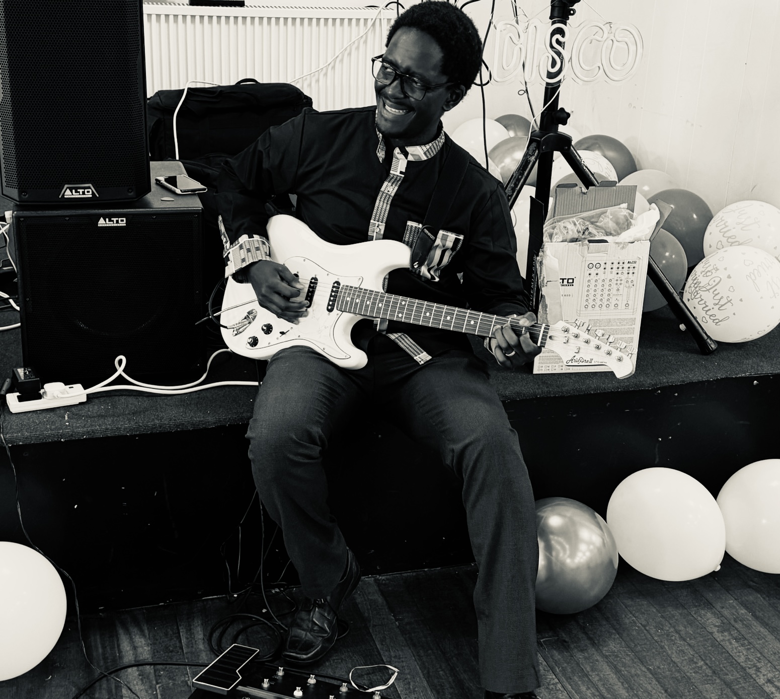Ian Businge performing
