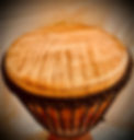Ian's beautiful djembe drum. Showing a cross-section of the drum head, against a warm and vivid background.