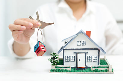 real-estate-agent-with-house-model-and-keys.jpg