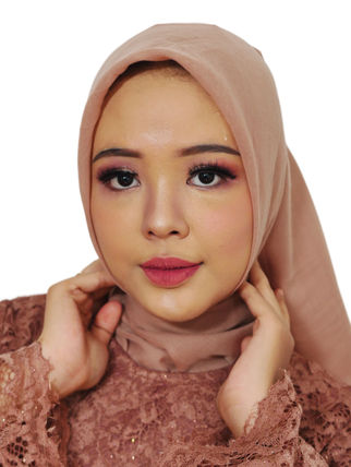 Close-up photo of a person's face with subtle makeup