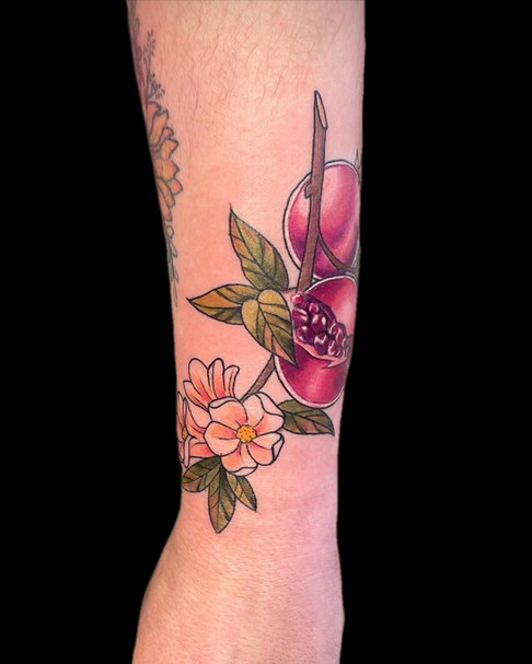 Colour pomegranate tattoo by Lauren