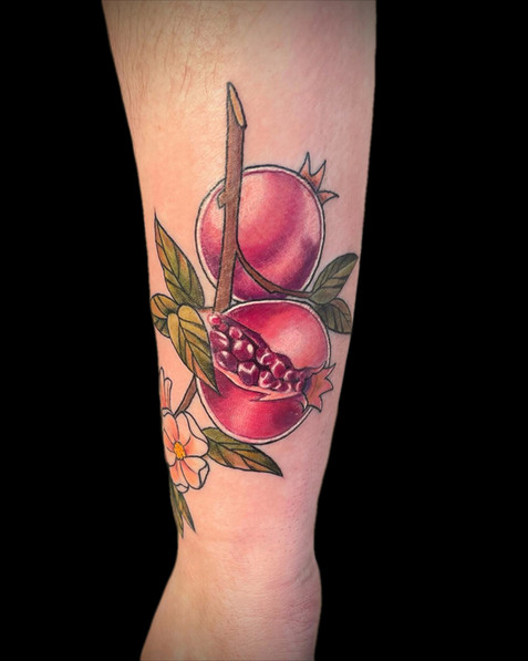 Colour pomegranate tattoo by Lauren