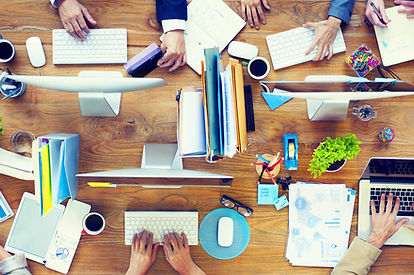 Group of Business People Working on an Office Desk.jpg