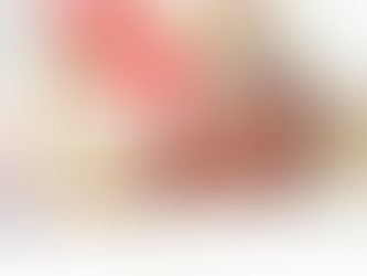 An infant sleeping on a white blanket