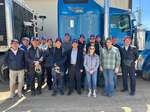 Japanese Trade Delegation posing with Jim Pellman and family during their recent visit.