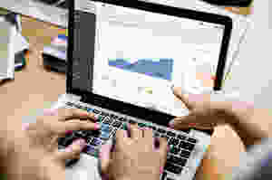 laptop showing data charts and graphs