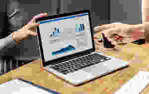 laptop showing data charts and graphs