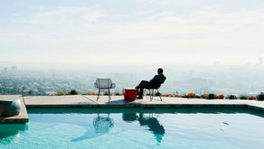 A rich man overlooking a beautiful landscape