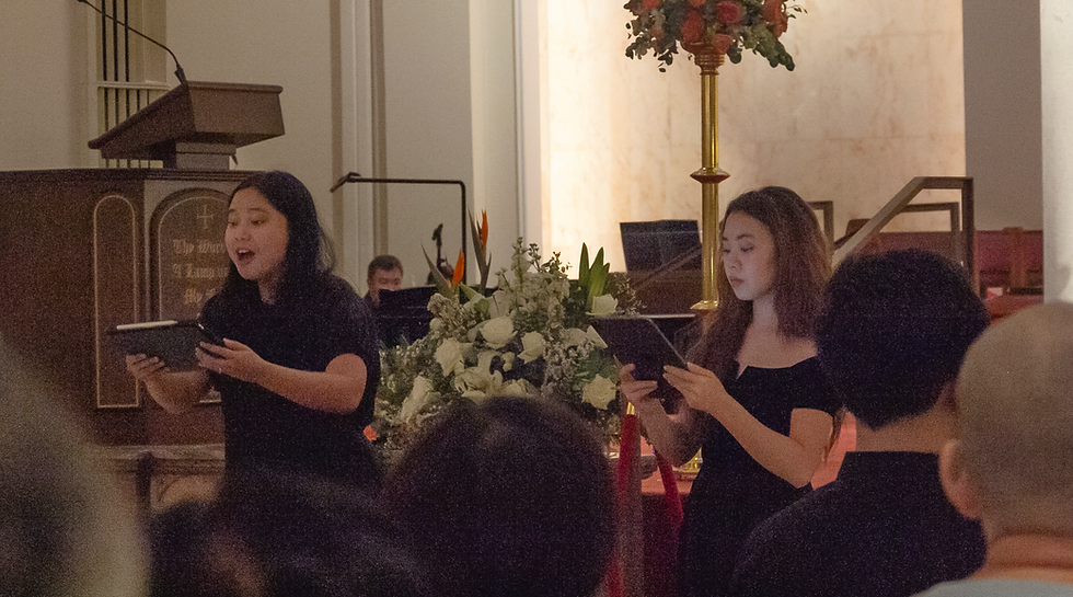 Caption: Soprano soloists Alice Putri (left) and Val Chong (right), accompanied by Gerard Wong (rear), perform the duet “He Shall Feed His Flock” from Messiah by Handel (1741).
Photo: Gwyneth Ho