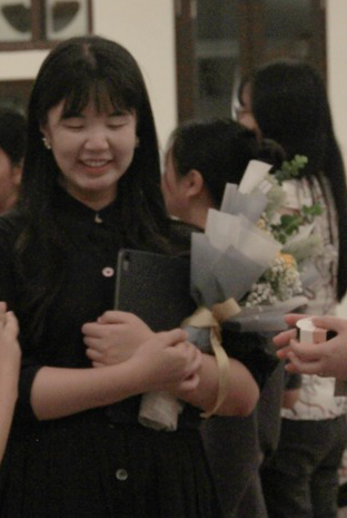 Right: Artistic Director Esther Jong shares a moment of fellowship with supporters at the Church of St. Teresa following the fundraising Easter sacred music concert,

Photo: Gwyneth Ho