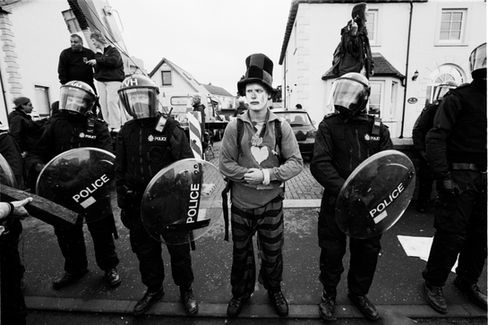 A member of CIRCA (Clandestine Insurgent Rebel Clown Army) joins a police line in Auchterarder during the G8 Summit which was at the nearby Gleneagles Hotel