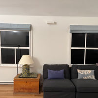"Cozy basement family room with arched ceiling and fake windows by Danko Construction Ltd, adding character and charm to the space.