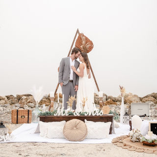 Couple kissing in front of 