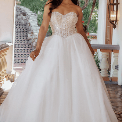 A beautiful bride wearing a ballgown.