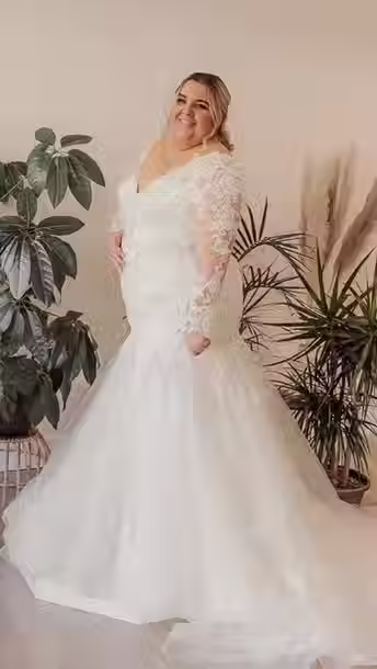 Bride in Long Sleeve Lace Mermaid Plus Size Wedding Dress with Tulle Skirt