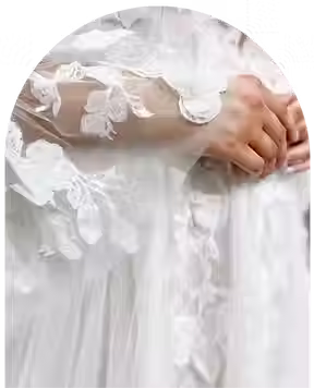 bride wearing a dress with lace sleeves.avif