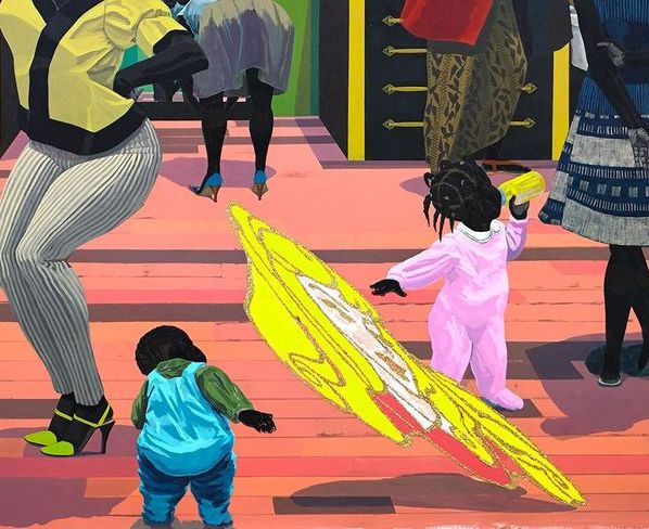 Children play on a colorful floor with abstract designs, surrounded by adults in vibrant outfits. One child holds a bottle, creating a lively scene.