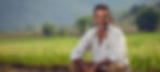 confident-smiling-indian-male-farmer-sitting-farmland-soil-wheat-fields-horizontal-9x4.jpg