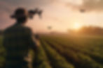 agriculture-man-working-plantation-with-drone-sunset-background.jpg